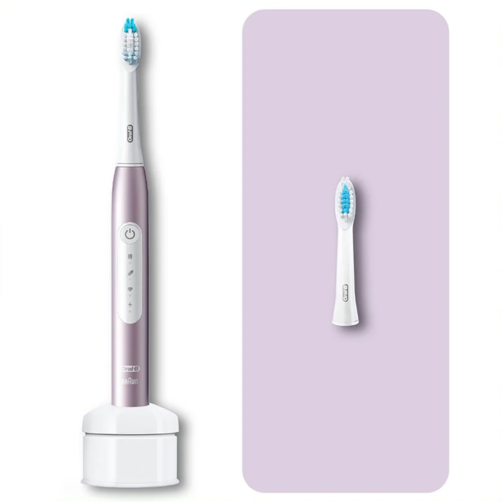 Oral-B elektrische Zahnbürste in Roségold mit Ladestation und Ersatzbürstenkopf.