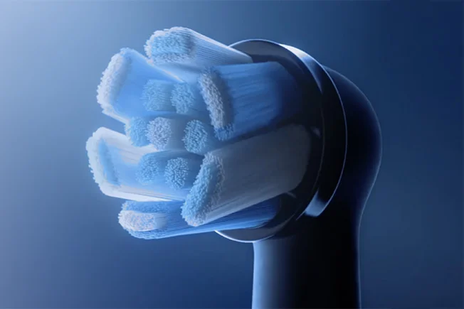 Oral-B iO Zahnbürste auf Magnet-Ladestation mit leuchtendem Wellen-Effekt